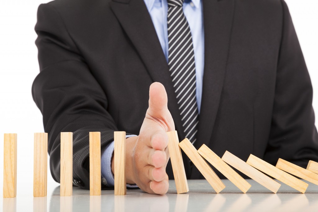 Businessman Hand Stop Dominoes Continuous Toppled